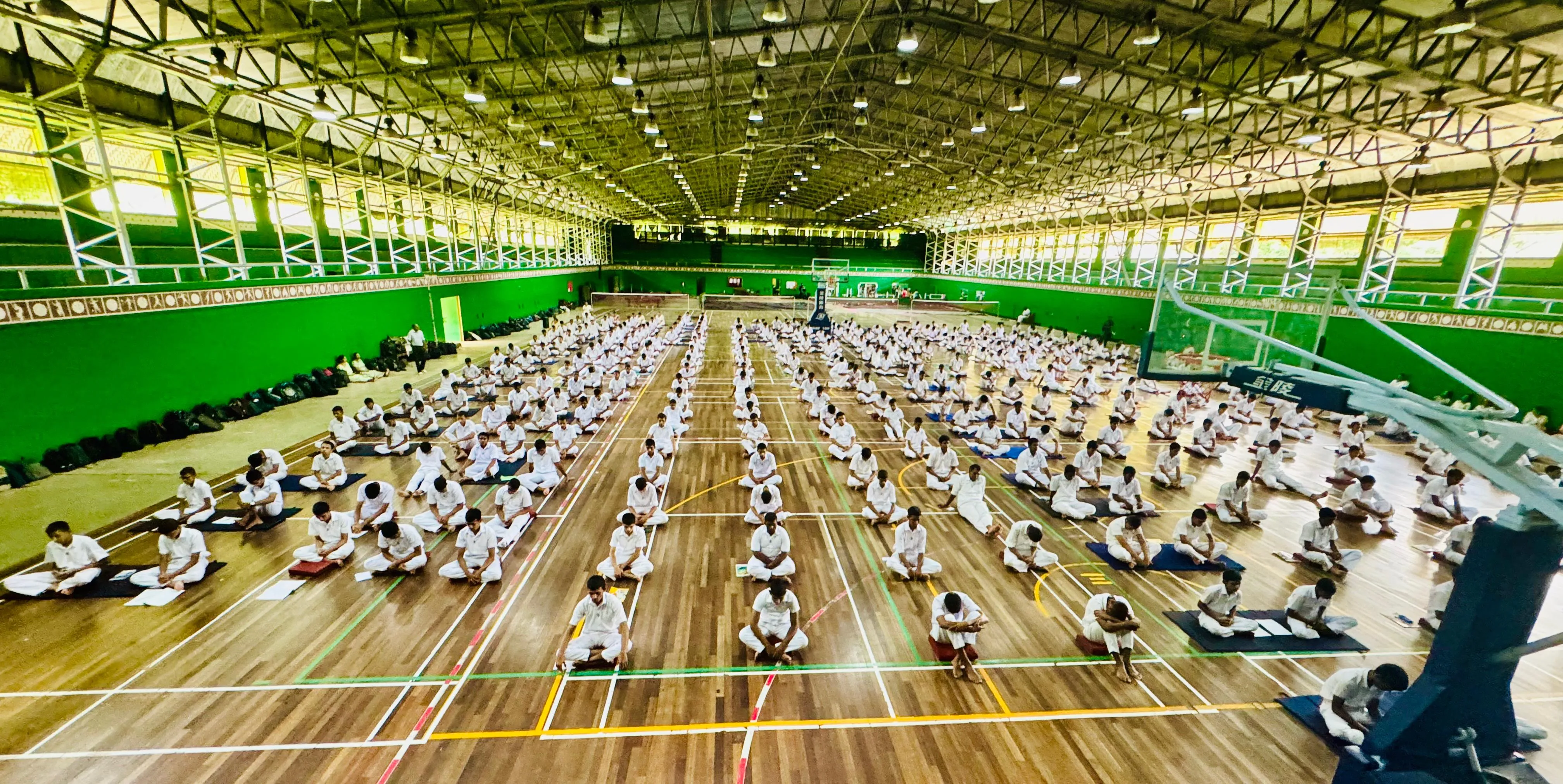 Hundreds of students seated for a mindfulness meditation program led by Nayana Daundasekara.