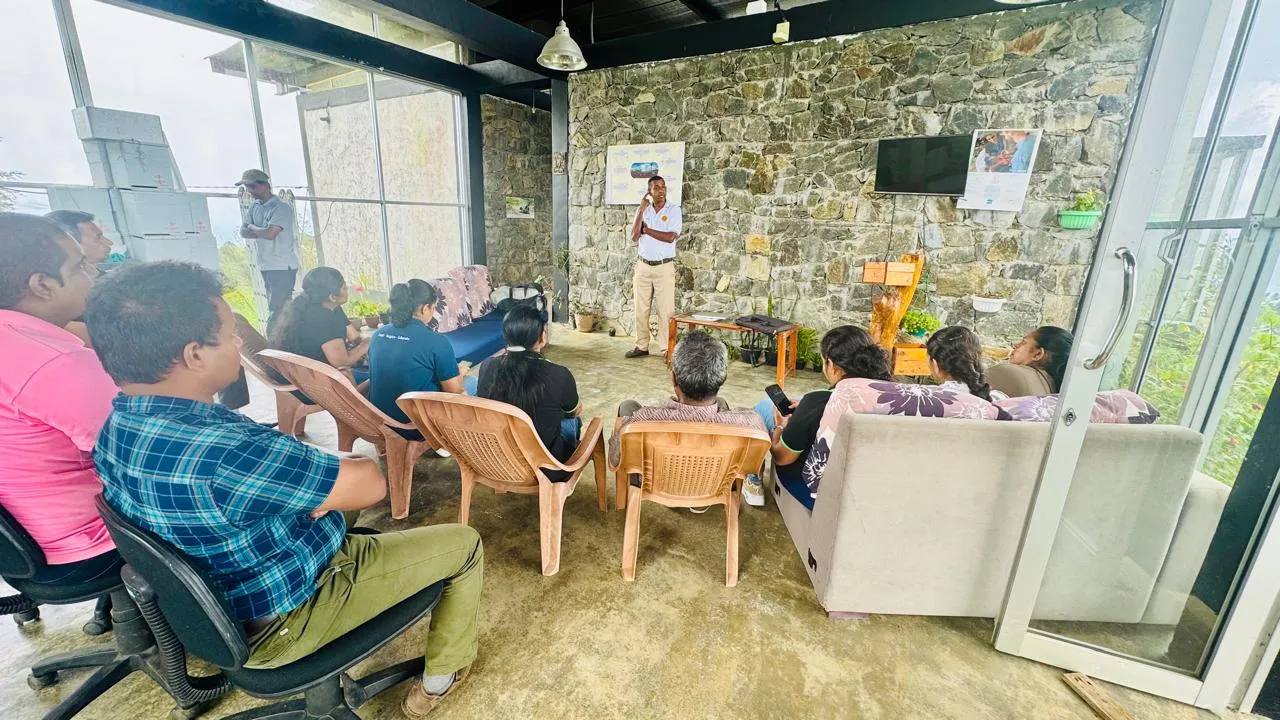 Nayana Pradeep presenting to participants seated in the workshop hall.