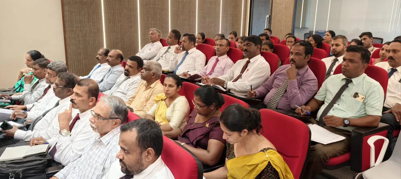 Principals seated and taking notes during the session.