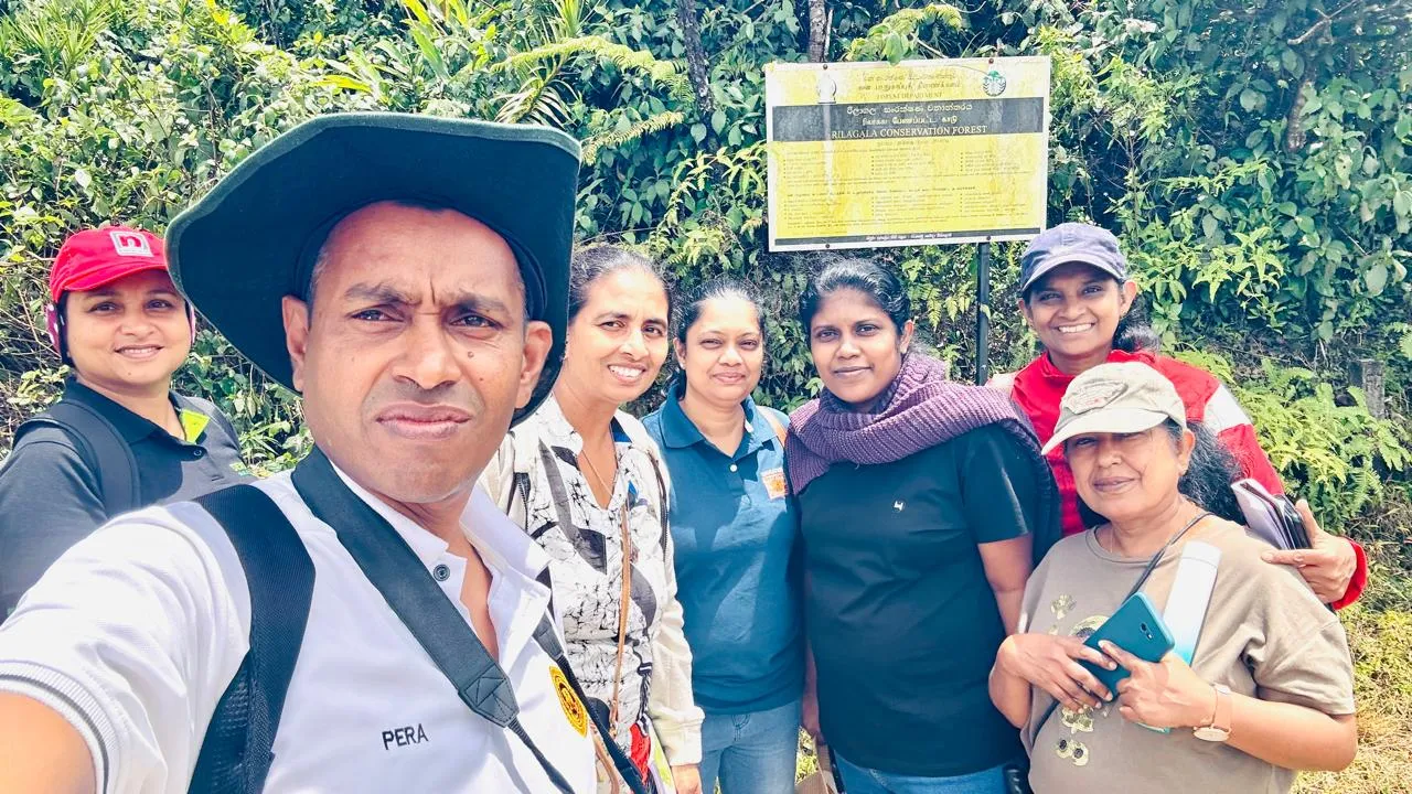 Participants at the Rilagala Conservation Forest signboard.