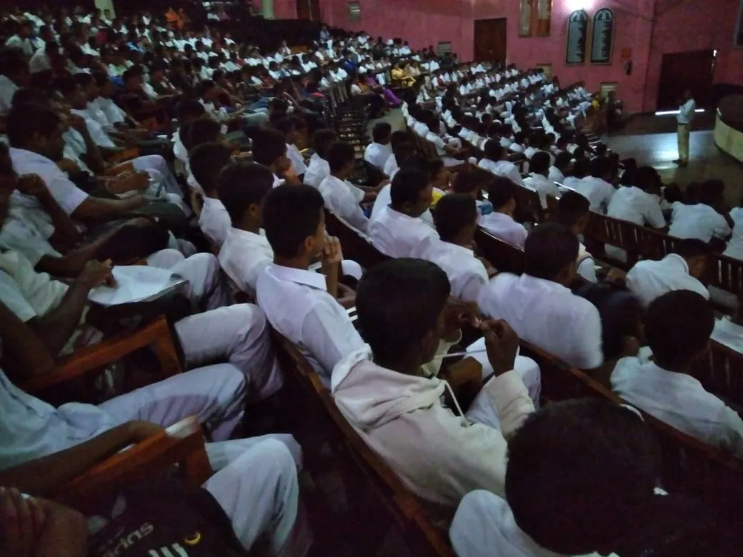 Students following the Agricultural Science presentation from the auditorium seating.