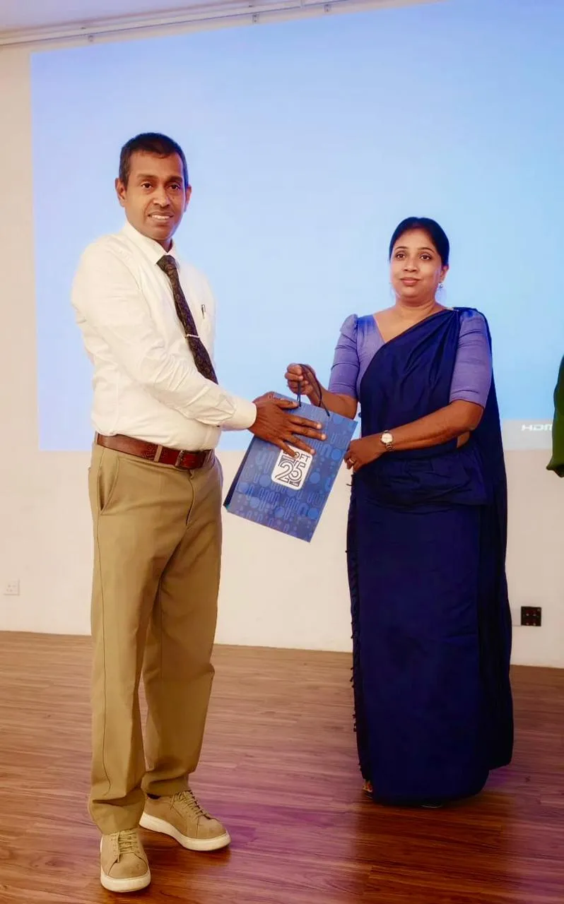 Nayana Pradeep receiving a token of appreciation at the close of the workshop.