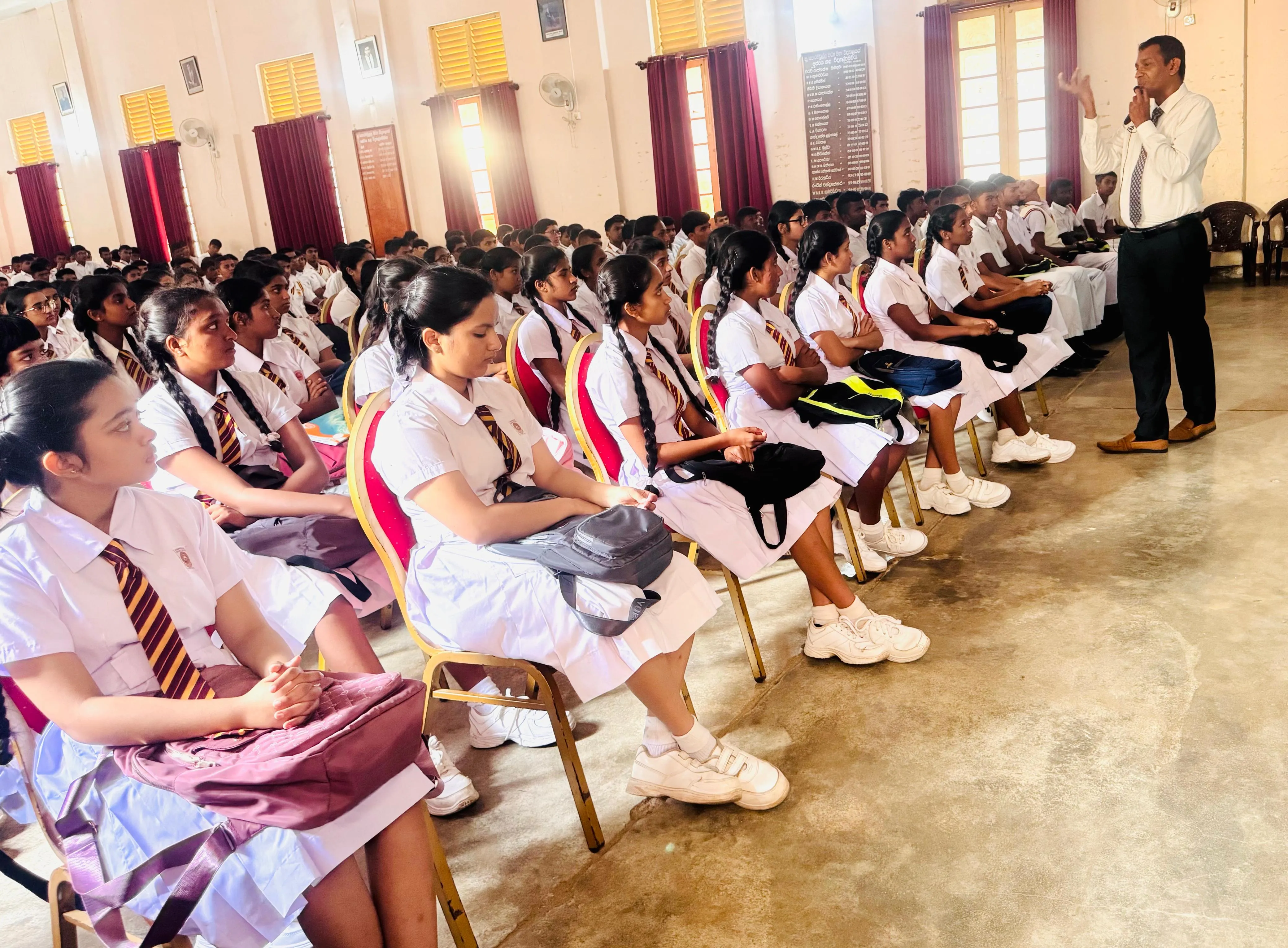 Nayana Pradeep engaging with Advanced Level students during the orientation workshop at Poramadulla Central College.